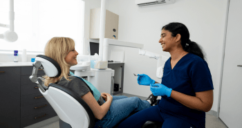 Dr. Diluni in a consultation with a Mulgrave Dental Group patient.