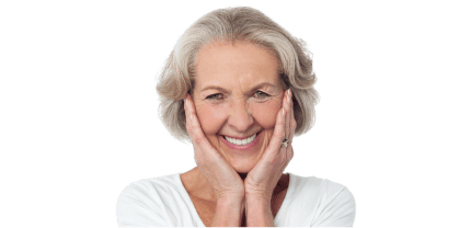 Smiling older woman with natural-looking dentures, showcasing a confident and comfortable smile.