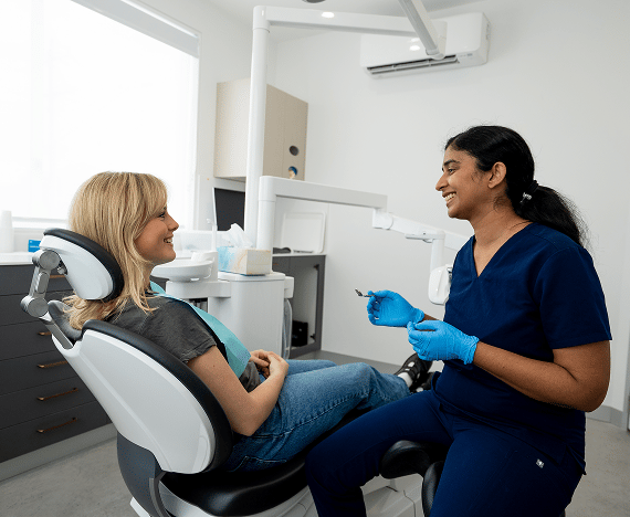 Dr. Diluni in a consultation with a Mulgrave Dental Group patient.