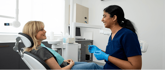 Dr. Diluni in a consultation with a Mulgrave Dental Group patient.