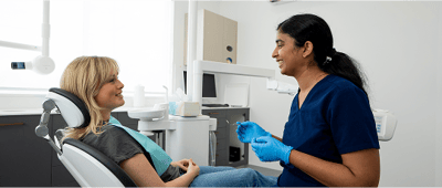Dr. Diluni in a consultation with a Mulgrave Dental Group patient.