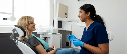 Dr. Diluni in a consultation with a Mulgrave Dental Group patient.