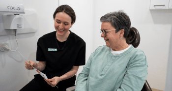 Mulgrave Dental Group Oral Health Therapist educating a patient on how best to maintain their oral health.