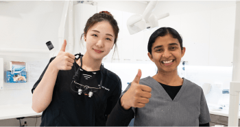 Mulgrave Dental Group staff smiling and giving a thumbs up to the camera.
