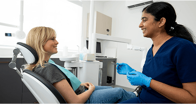 Dr. Diluni in a consultation with a Mulgrave Dental Group patient.