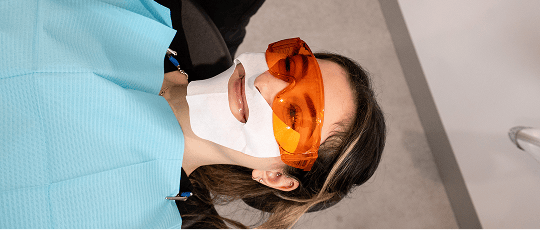A Mulgrave Dental Group patient wearing protective goggles, getting ready for Zoom teeth whitening treatment.