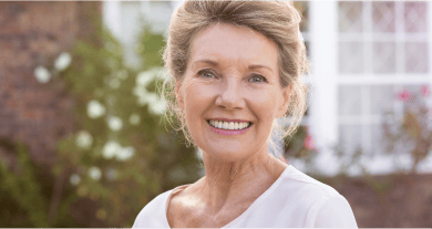 Smiling older woman with a beautiful denture smile.