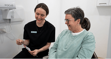 Mulgrave Dental Group Oral Health Therapist educating a patient on how best to maintain their oral health.