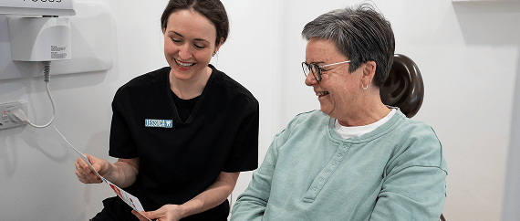 Mulgrave Dental Group Oral Health Therapist educating a patient on how best to maintain their oral health.