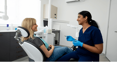 Dr. Diluni in a consultation with a Mulgrave Dental Group patient.