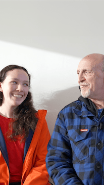 Thumbnail of a smiling parent and child, with the parent sharing their satisfaction with the service and first-class facilities at Mulgrave Dental Group.