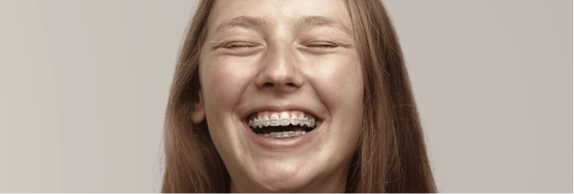 Laughing girl with braces.