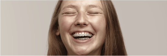 Laughing girl with braces.