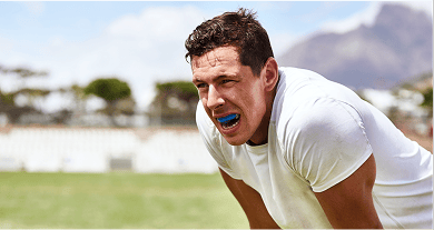 A man playing sports with a dental mouthguard.