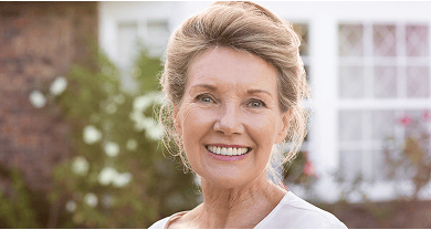 Smiling older woman showing off her beautiful smile.