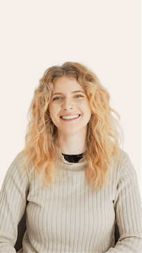 Thumbnail of a patient talking about how she can't stop smiling after getting Invisalign and veneers from Mulgrave Dental Group.