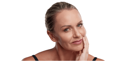 Middle-aged woman with smooth, youthful skin gently touching her face.