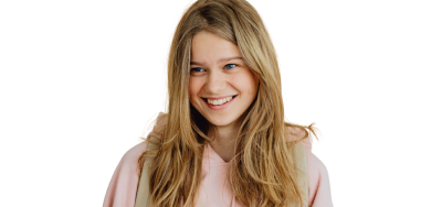 Smiling teenage girl wearing a hoodie and backpack, holding a smartphone.