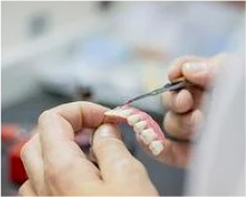 Dentist working on All on 4 Mold Set - Mulgrave Dental Group